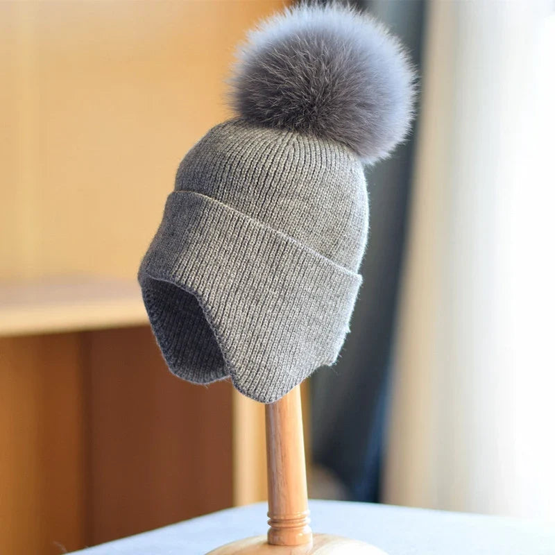 Soft, cozy alpine pom beanie, unisex. Provides ultimate winter warmth and comfort for cold weather adventures.