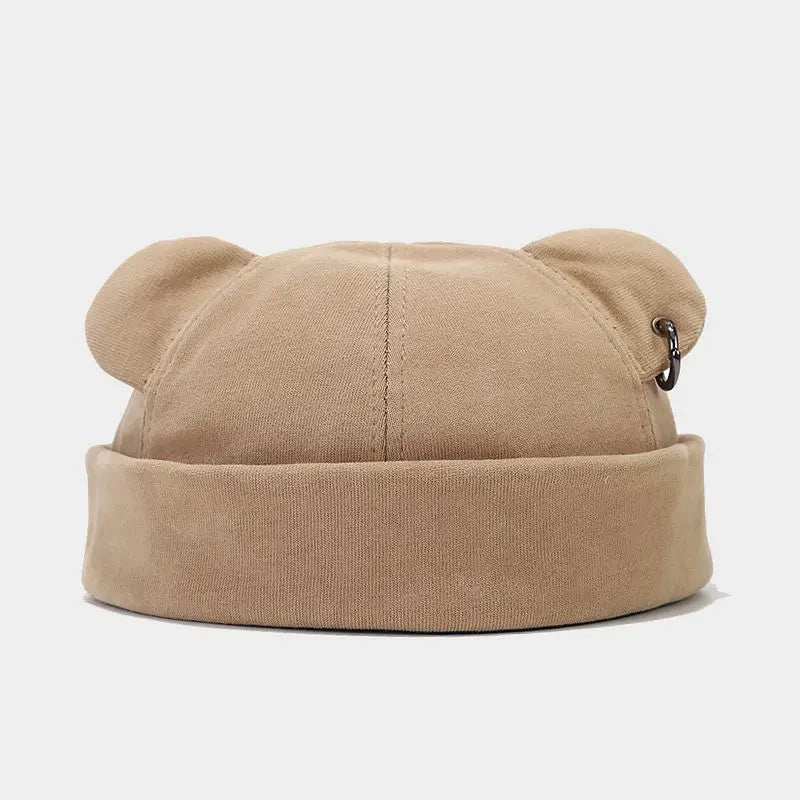 Playful bear cub beanie hat, a cozy unisex accessory with cute ears for adding fun to your winter outfit.