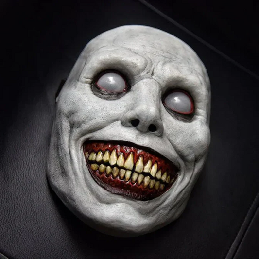 Unisex creepy smiling demon mask with disturbing white eyes for Halloween and horror cosplay costumes.