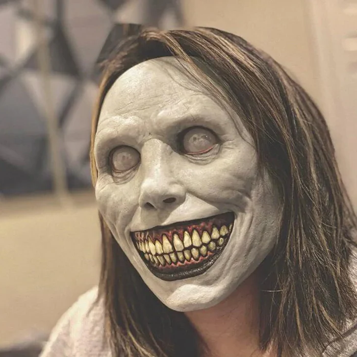 Creepy white-eyed demon mask with a chilling smile, ideal for horror events, cosplay, or costume parties.