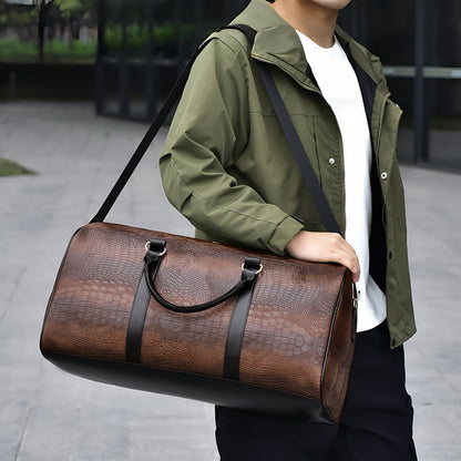 Sophisticated croc-embossed vegan leather weekender bag, perfect for travel. Unisex design, waterproof.