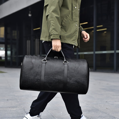 Spacious unisex croc-embossed vegan leather gym bag. Durable weekender duffle with comfy shoulder strap.