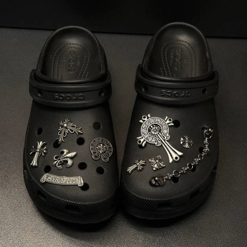 Collection of unisex metal shoe charms for Crocs, including chrome and Lost Saturn designs.