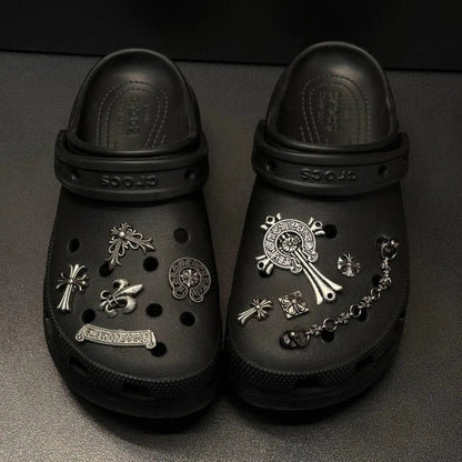 Collection of unisex metal shoe charms for Crocs, including chrome and Lost Saturn designs.