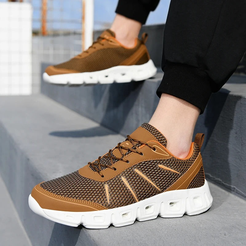 Breathable mesh upper and cushioned sole of unisex running shoes, designed for lightweight, all-day comfort.