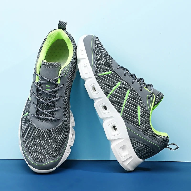 Runner wearing unisex cushioned athletic shoes, demonstrating flexibility and all-day comfort on the track.