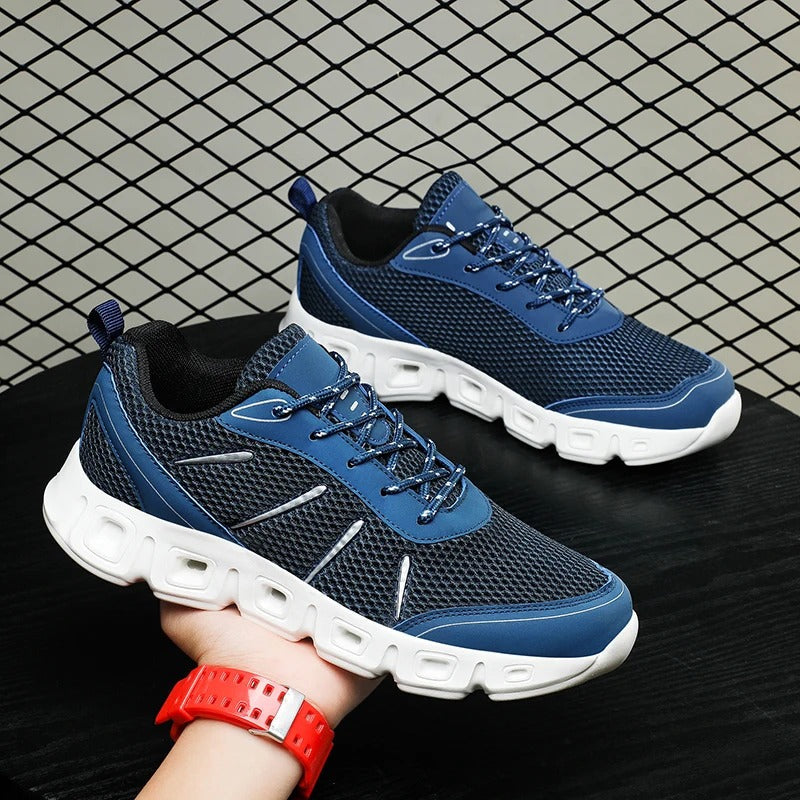Stylish unisex cushioned sneakers in a neutral design, offering breathable comfort & supportive athletic performance.