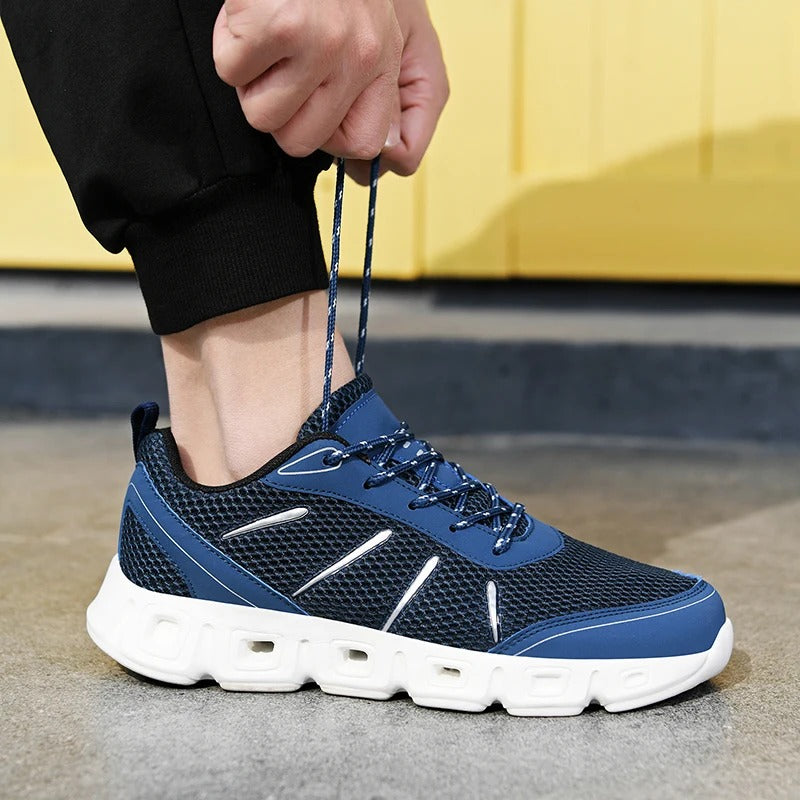 Durable sole of unisex running footwear, providing excellent grip & flexible support for various athletic activities.