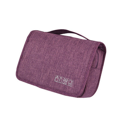 Open hanging toiletry bag displaying organized makeup and travel essentials.