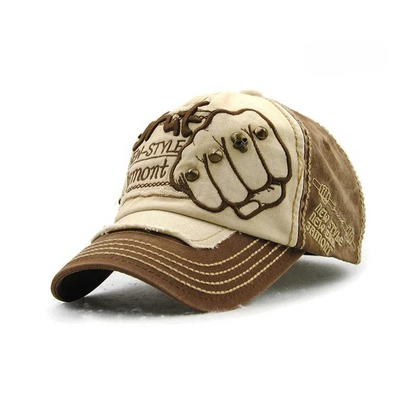 Statement unisex baseball hat with striking fist design embroidery, ideal headwear for street fashion.