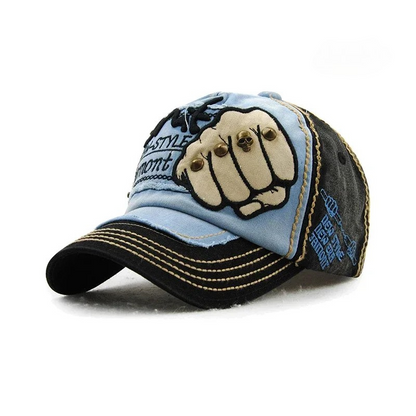 Unisex headwear: a denim baseball cap with a bold fist design, embroidery, and stylish metal studs.