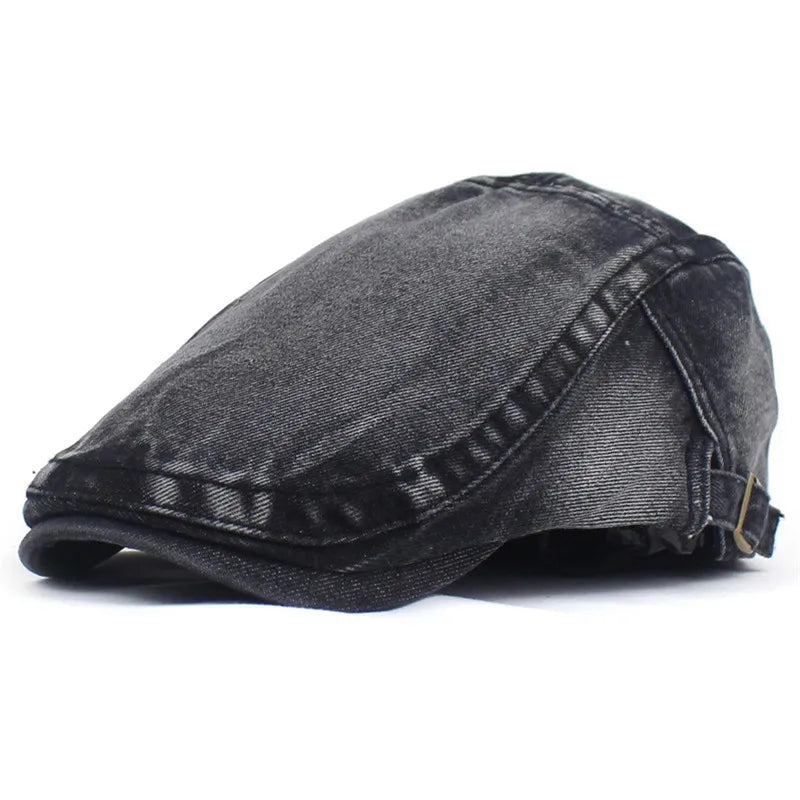 Classic blue denim ivy cap with a flat peak, offering timeless unisex style & casual headwear.