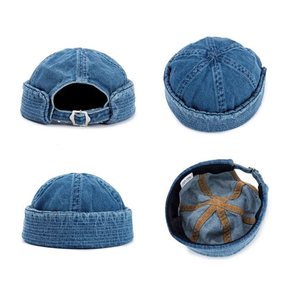 Classic denim cap featuring a trendy rolled brim. An adjustable unisex hat for effortless casual style.