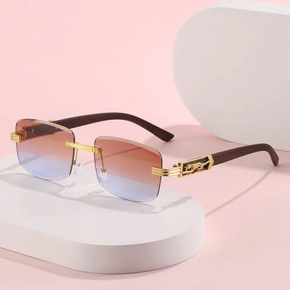 Chic unisex designer sunglasses; rimless frame with gradient lenses and distinct wood texture temples.