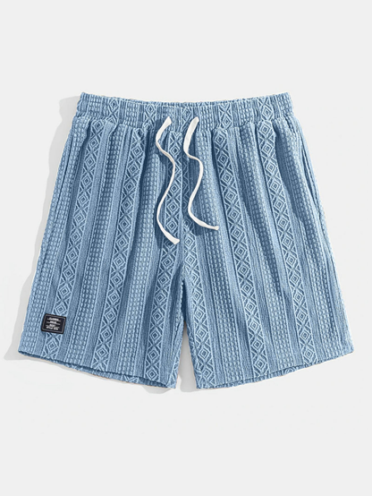 Soft, breathable unisex knit shorts featuring an elegant diamond pattern, perfect for lounging.