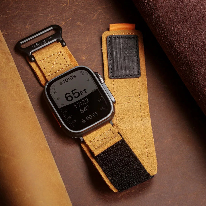 Unisex distressed suede Apple Watch band with secure velcro, perfect for rugged adventure.