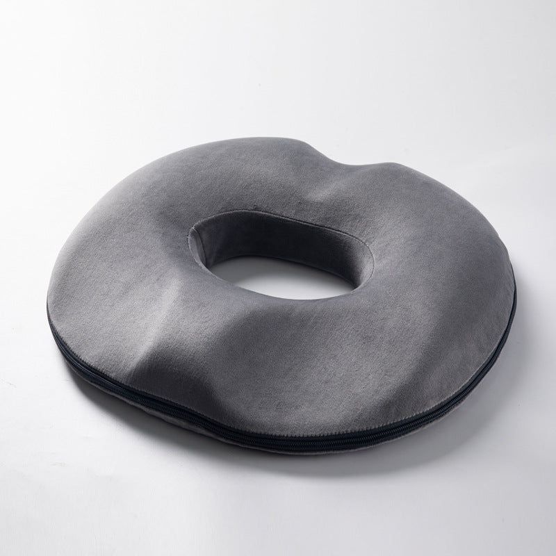 Gray ergonomic donut cushion, memory foam. Designed for tailbone pain, hemorrhoid & pressure relief.