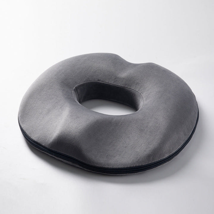 Gray ergonomic donut cushion, memory foam. Designed for tailbone pain, hemorrhoid & pressure relief.
