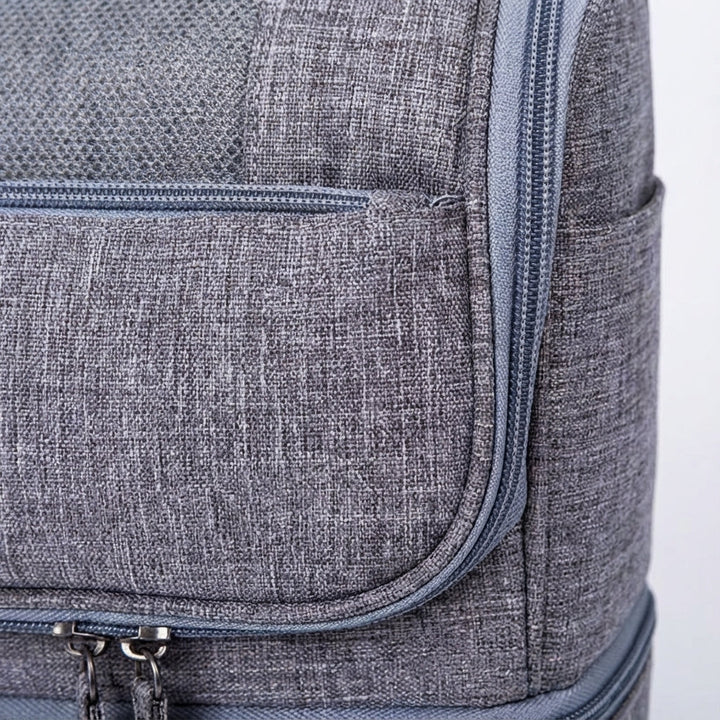 Hanging waterproof travel toiletry bag, double compartment for men's & women's essentials.
