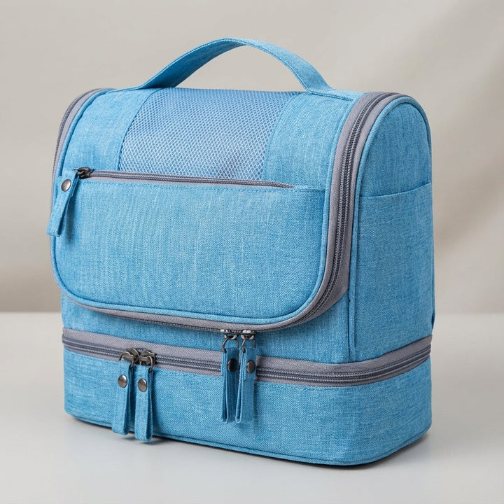 Spacious double compartment toiletry bag, waterproof, keeps travel accessories neatly organized.