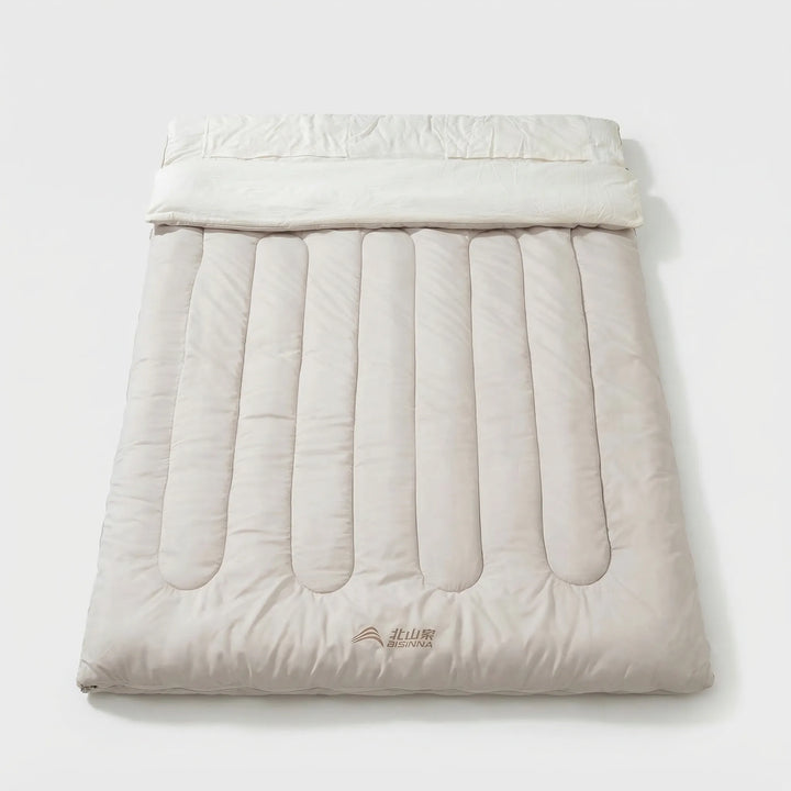 Comfortable double camping sleeping bag, detachable for warmth. Ideal outdoor gear for couples & hiking.