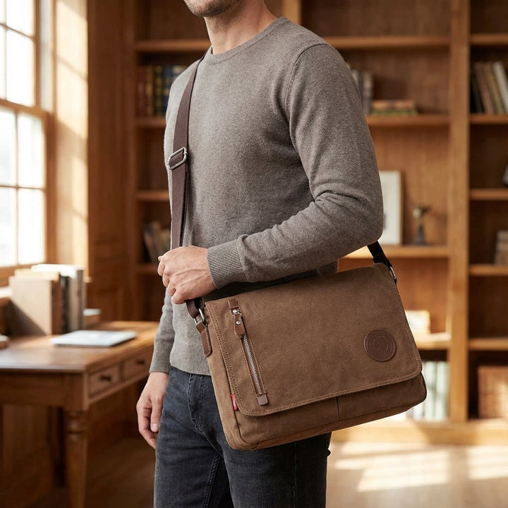 Unisex durable canvas shoulder bag, perfect for everyday carry. Messenger style with adjustable strap.
