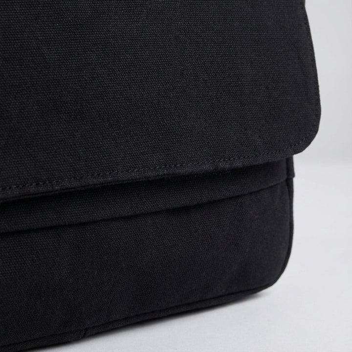 High-quality unisex durable canvas shoulder bag, ideal for men & women. Great for school, travel, or everyday carry.