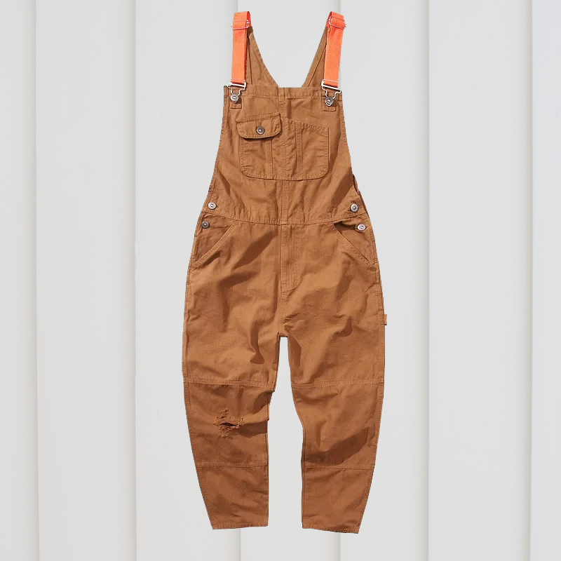 Rugged cotton twill unisex garden dungarees with adjustable straps & utility pockets.
