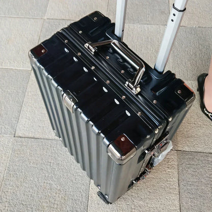 Protective grey travel luggage, 360-degree spinner wheels for easy navigation. Perfect for family vacations.