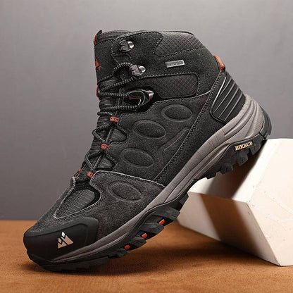 Unisex black and blue durable trekking sneakers, worn by hiker in outdoor setting, adventure gear