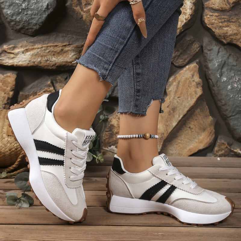 Front view: Durable unisex sneakers with sturdy design, great for active wear & comfort.