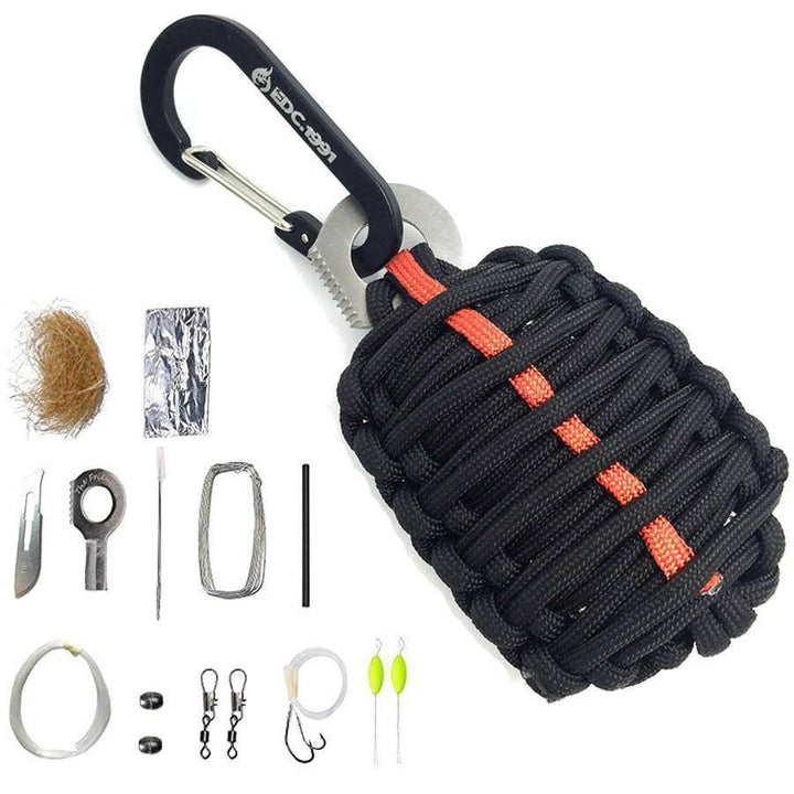 Survival grenade kit with unraveled paracord, displaying internal EDC and emergency tools.