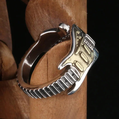 Musical jewelry set featuring an electric guitar necklace and matching ring. Unisex rock style accessory.