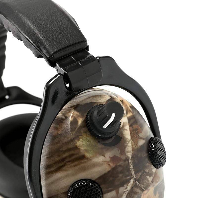 Full set: black electronic hearing protection earmuffs and clear ballistic glasses on a white background