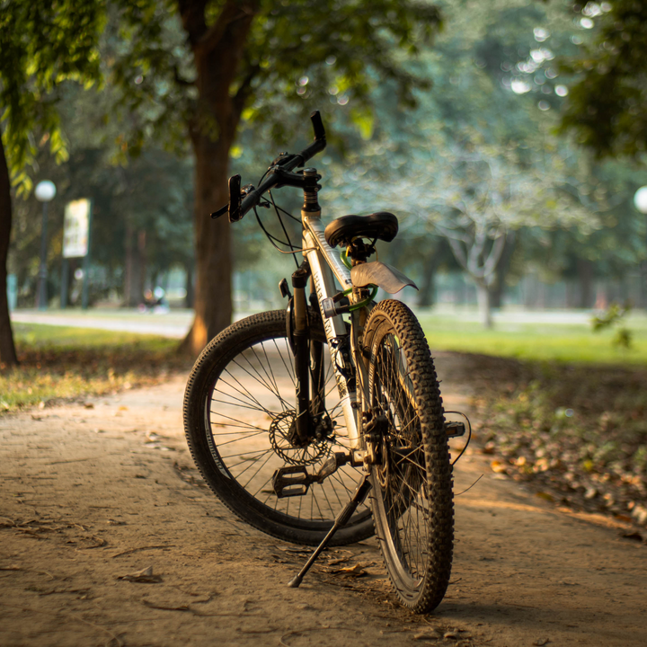 Unisex ergonomic bicycle saddle from a side view, highlighting its contoured design