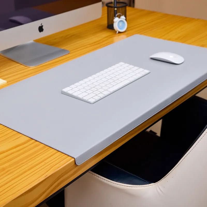 Modern ergonomic PU leather desk mat & pad with soft wrist support for professional, comfortable computer use.