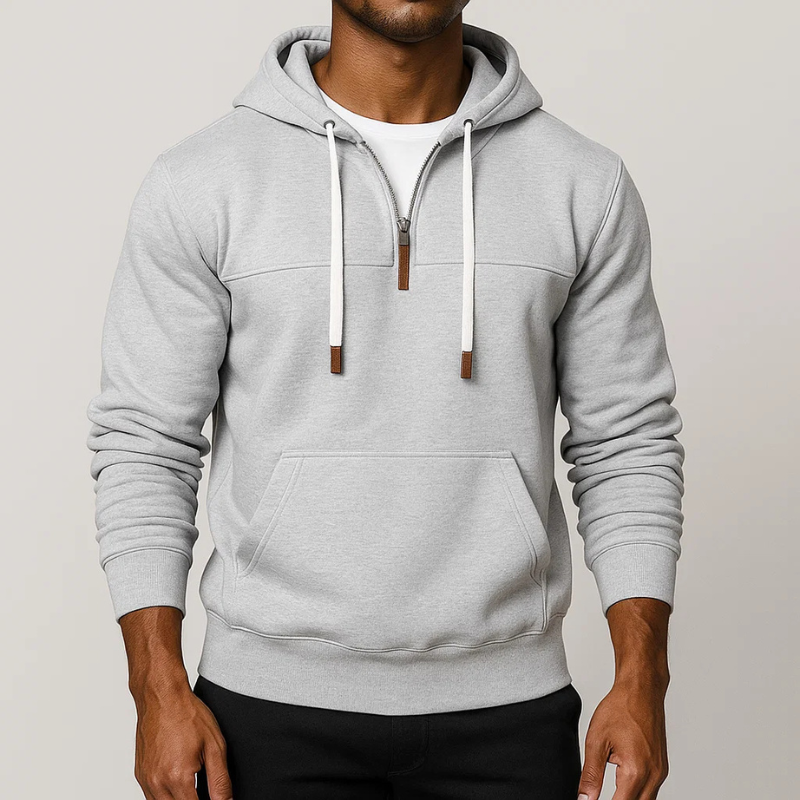 Cozy unisex half-zip hoodie, a versatile pullover for everyday comfort, ideal for cool weather layering.