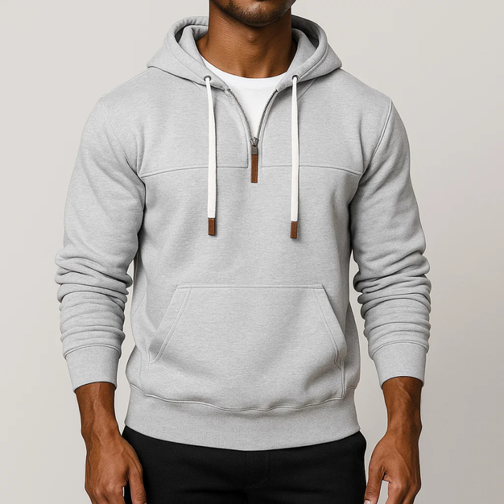 Cozy unisex half-zip hoodie, a versatile pullover for everyday comfort, ideal for cool weather layering.