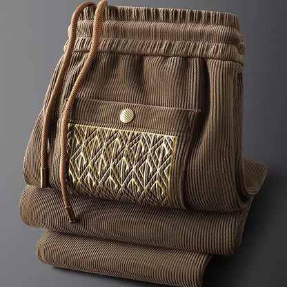 Versatile casual unisex pants, ideal for everyday, travel, or lounging, featuring subtle gold details.