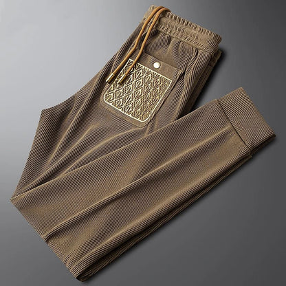 Everyday unisex casual pants, soft & flexible ribbed fabric, enhanced with sleek gold detail for premium feel.