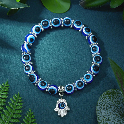 Unisex Evil Eye Anklet with an Owl charm, symbolizing wisdom & protection. Blue beaded stretch fit spiritual jewelry.