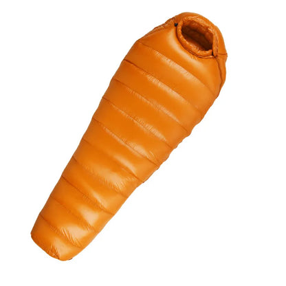 Comparing the compact size of the Unisex Extreme Weather Down Mummy Sleeping Bag when packed, ideal for hiking gear
