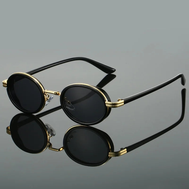 Trendy unisex round sunglasses in a classic black finish, providing stylish UV protection and a chic fashion accessory.
