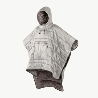 Happy hiker wearing a warm fleece-lined poncho, enjoying the outdoors while staying dry and comfortable
