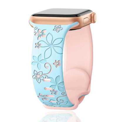 Close-up of an intricately floral engraved silicone smartwatch band, showcasing unique detail and style.