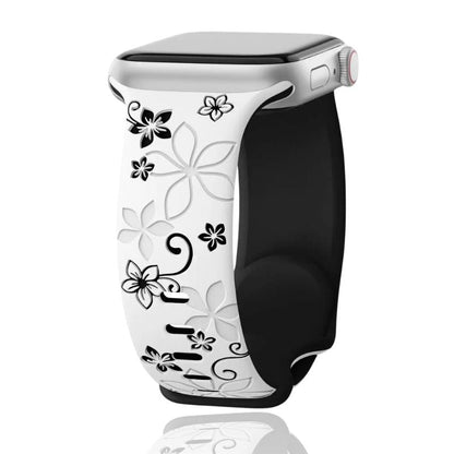 Unisex silicone smartwatch band with a floral engraving, comfortably worn on a wrist for everyday fashion.