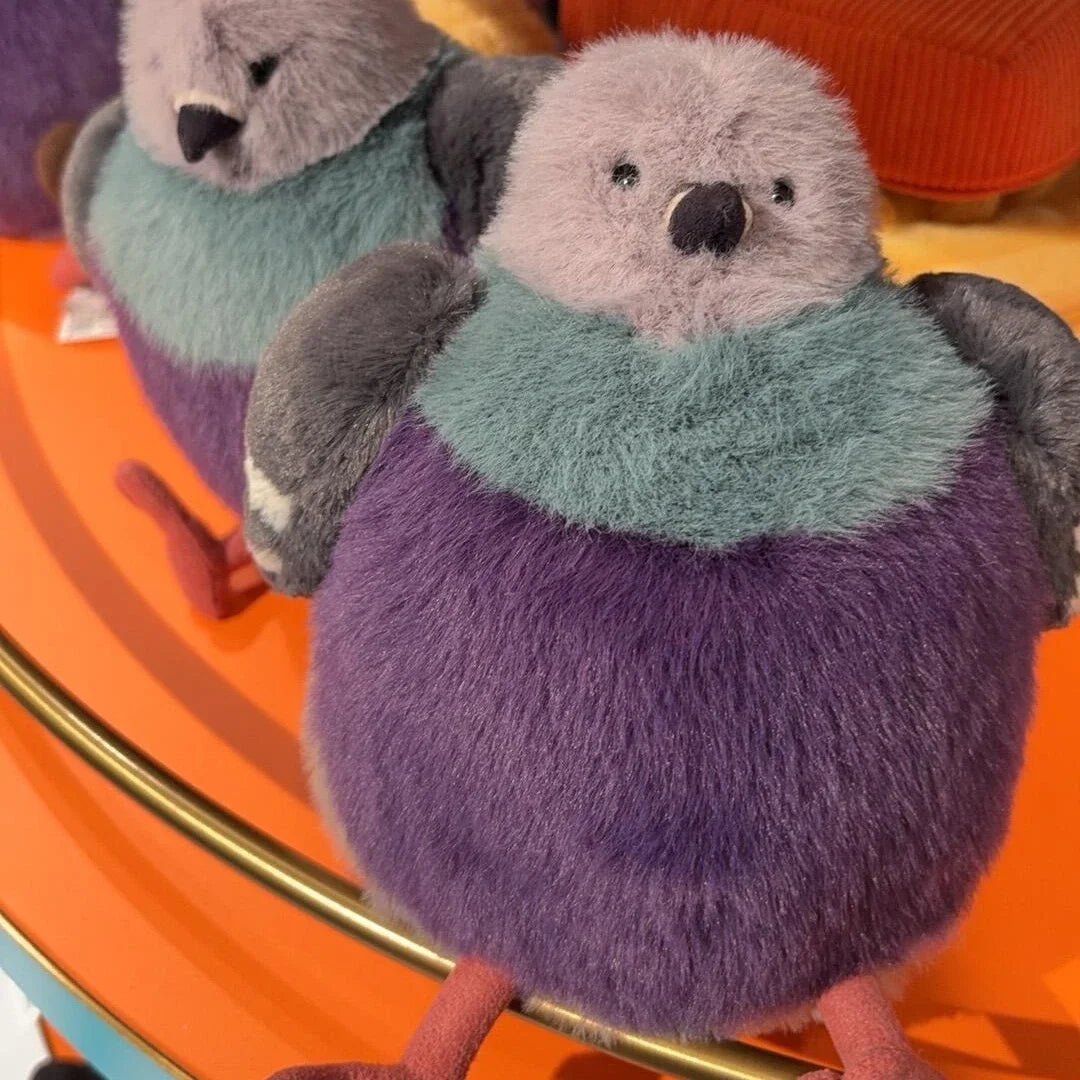 Soft fluffy pigeon plush toy, a comforting cuddly stuffed animal, perfect for snuggling and providing warmth.
