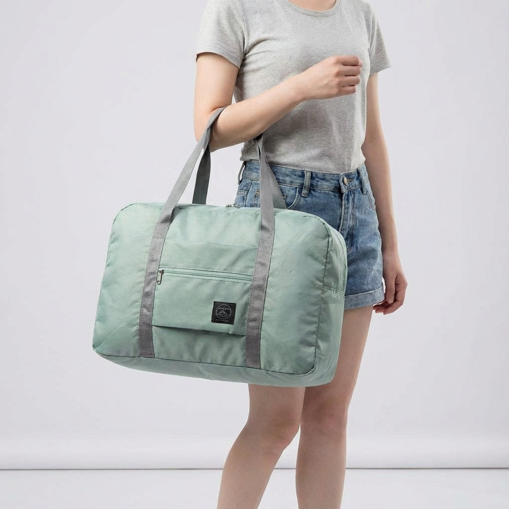 Compact folded lightweight duffel bag. Ideal personal item for easy storage in luggage or home.