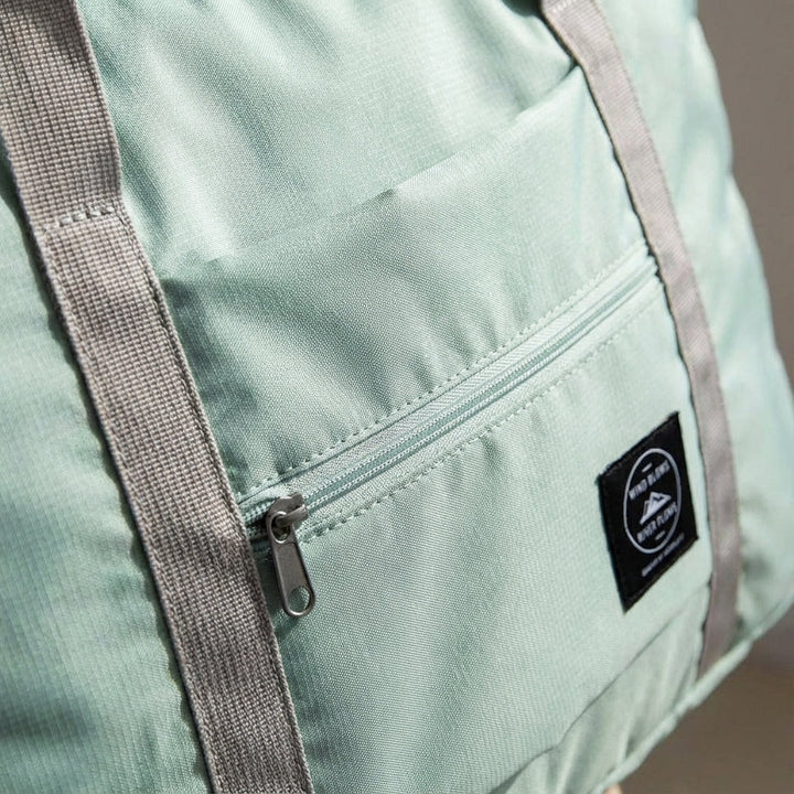 Spacious unisex travel duffel bag unfolded. Lightweight, waterproof, great for weekend getaways & carry-on.