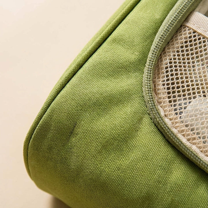 Open TrailTidy toiletry bag hanging, revealing multiple compartments for organized travel toiletries.